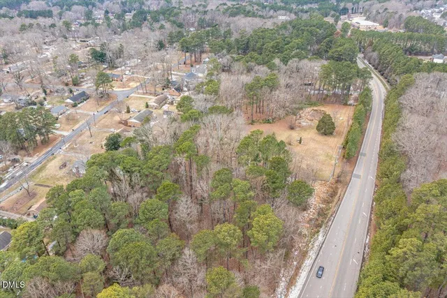a aerial view of a house with a yard