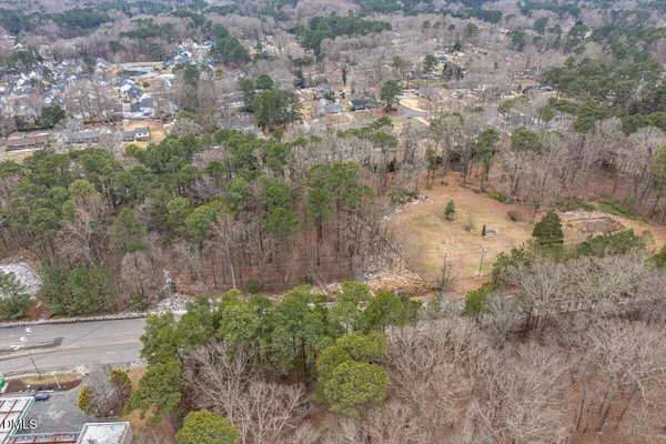 a view of a yard with trees