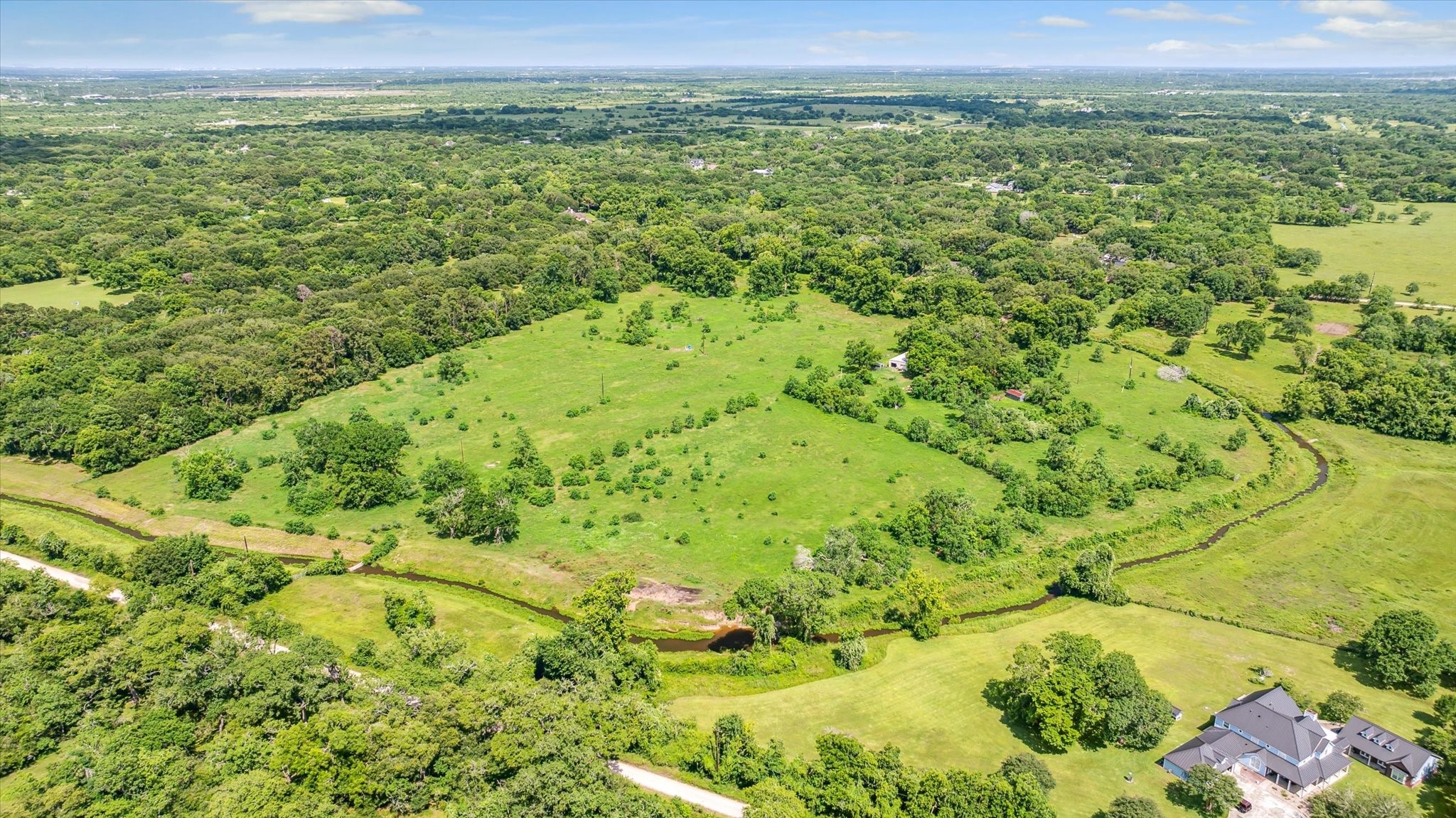 5634 Patterson Road Manvel, TX 77578 - Photo 5 of 8 a view of a lush green field