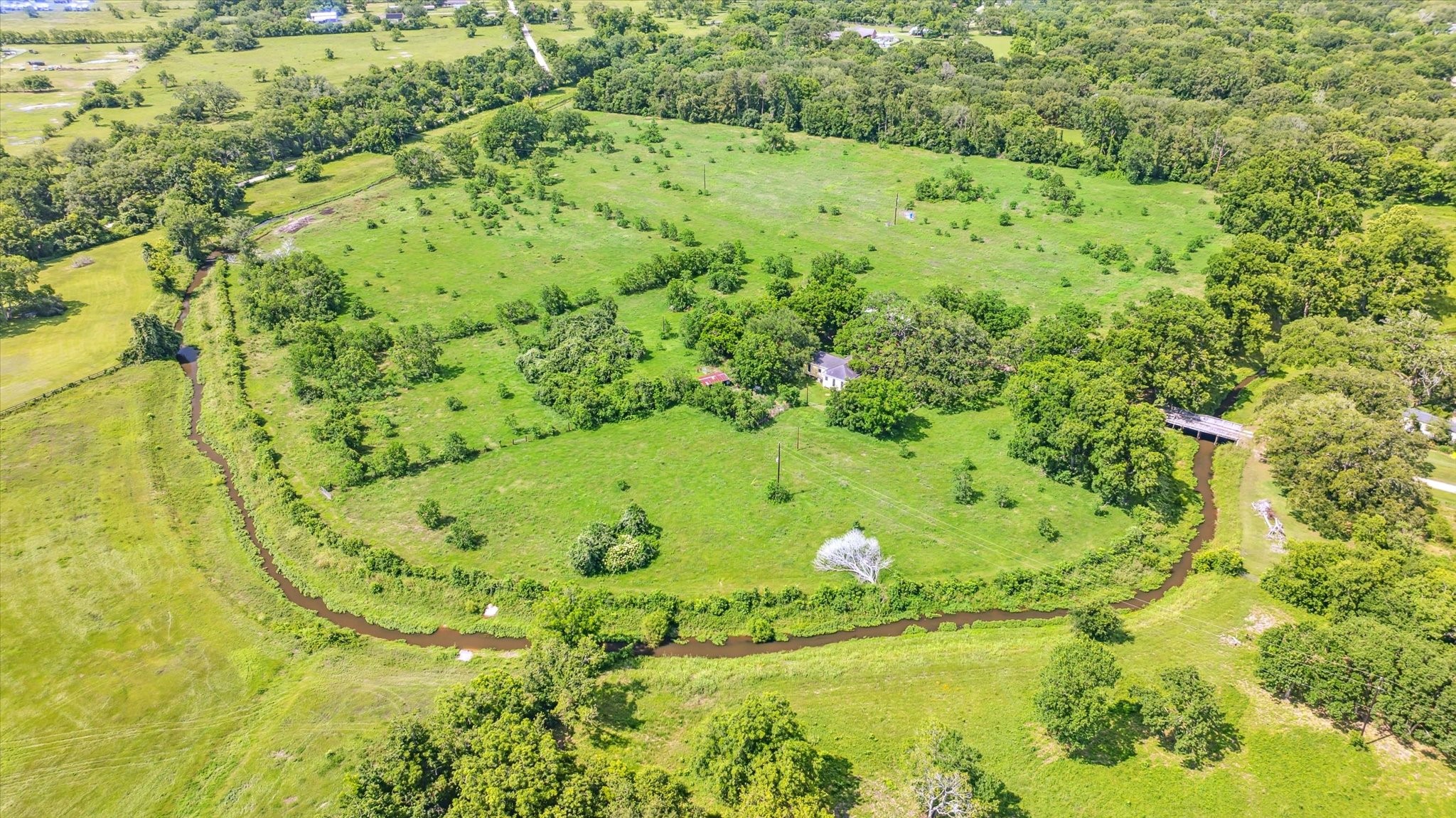 5634 Patterson Road Manvel, TX 77578 - Photo 7 of 8 a view of a swimming pool from a lake view