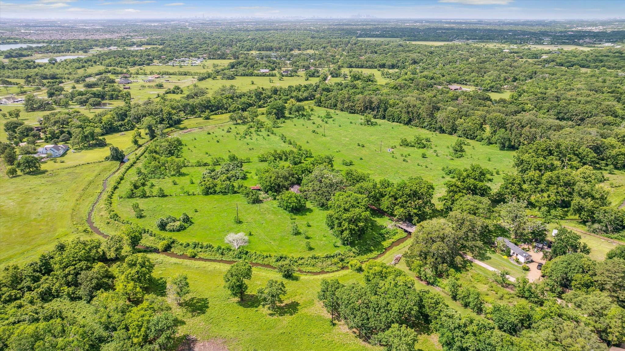 5634 Patterson Road Manvel, TX 77578 - Photo 8 of 8 a view of a lush green field