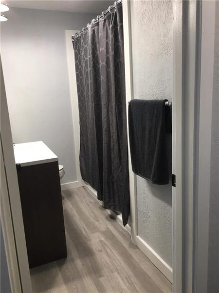 320 Scene Ridge Road McKeesport, PA 15133 - Photo 15 of 18 A freshly remodeled bathroom rounds out the bottom floor! Wait! There's still four bedrooms and two, single car integral garages to see!!!