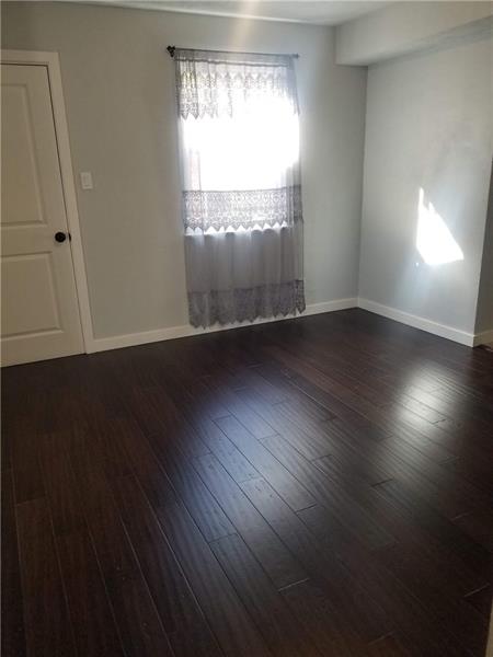 Beautiful bamboo floors throughout the main level common area give this home a modern feel, with the welcoming feel of a new remodel! Large pantry door on the left with lots of space to keep everything stocked! 