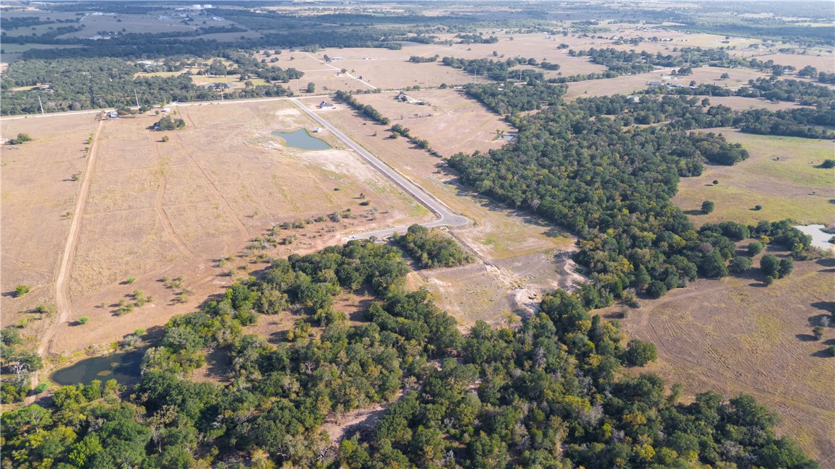 Tbd Tbd Plata Way Bryan, TX 77808 - Photo 27 of 30 an aerial view of a house with a yard and mountain view in back