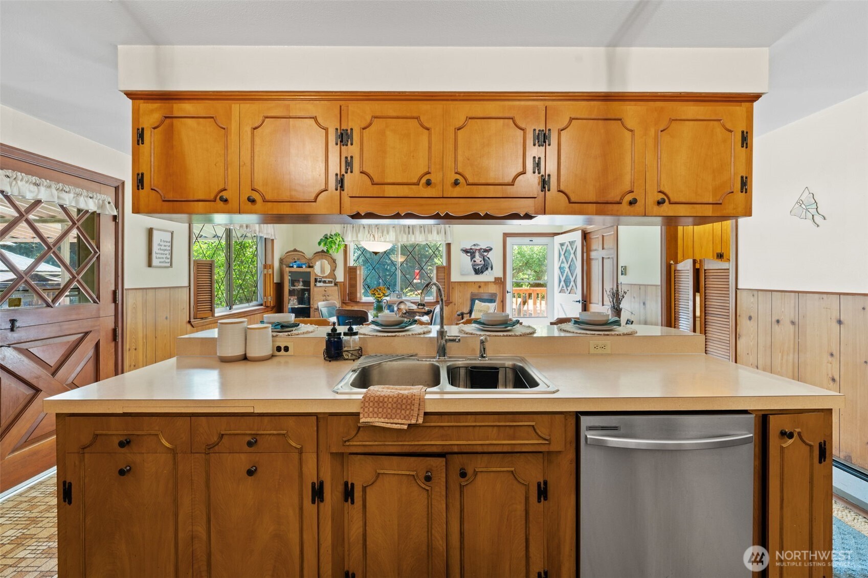 1906 164th Street South Spanaway, WA 98387 - Photo 14 of 35 a kitchen with a sink a stove cabinets and wooden floor