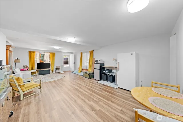 a view of a livingroom with wooden furniture and a couch