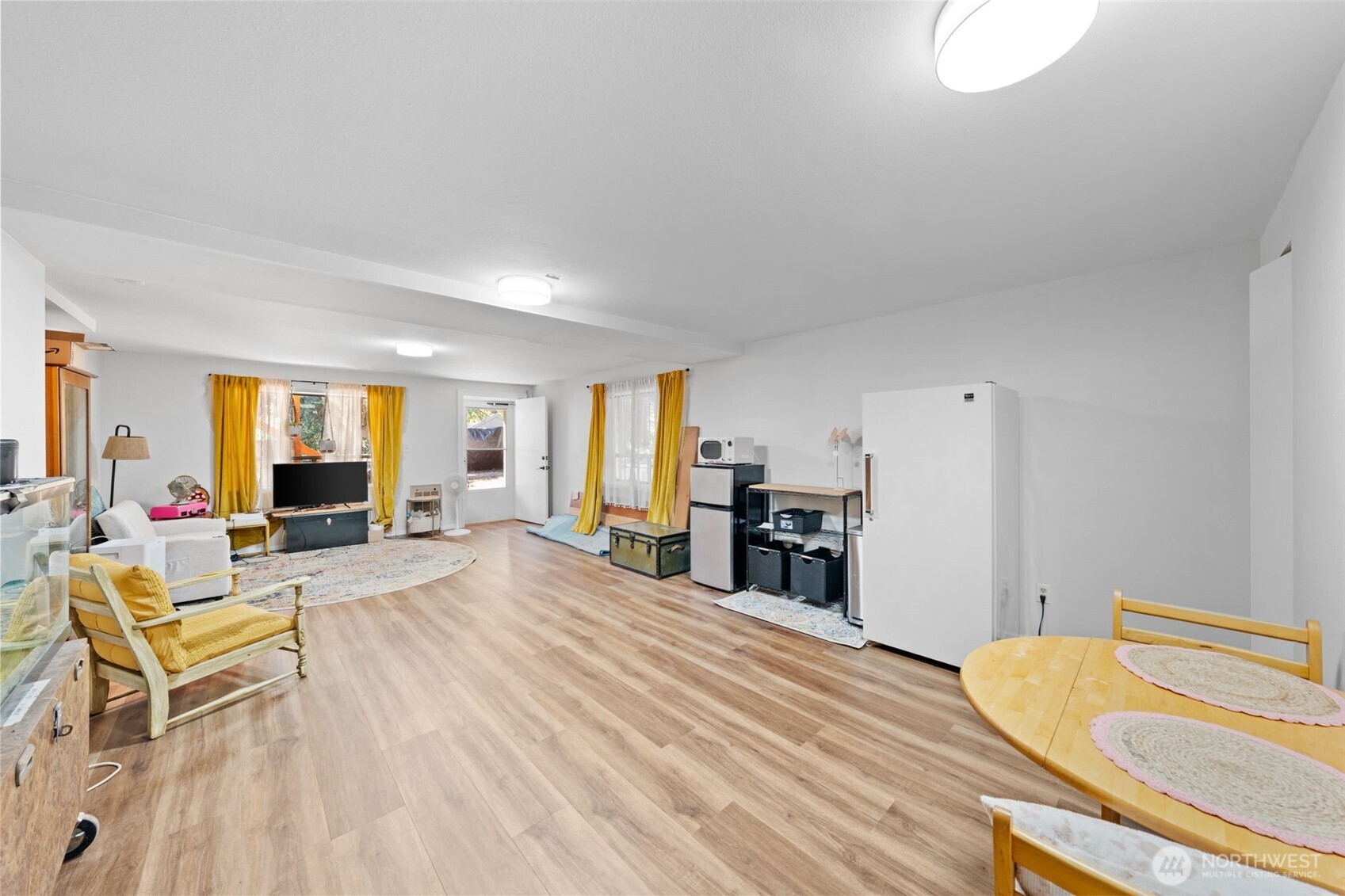 1906 164th Street South Spanaway, WA 98387 - Photo 22 of 35 a living room with furniture and a flat screen tv