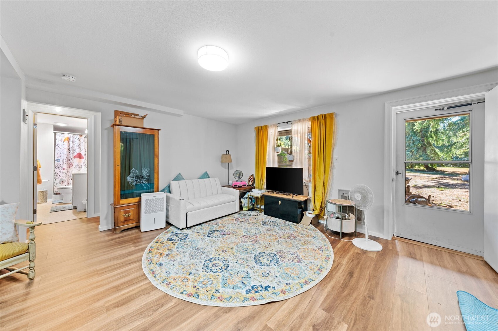 1906 164th Street South Spanaway, WA 98387 - Photo 24 of 35 a living room with furniture and a wooden floor