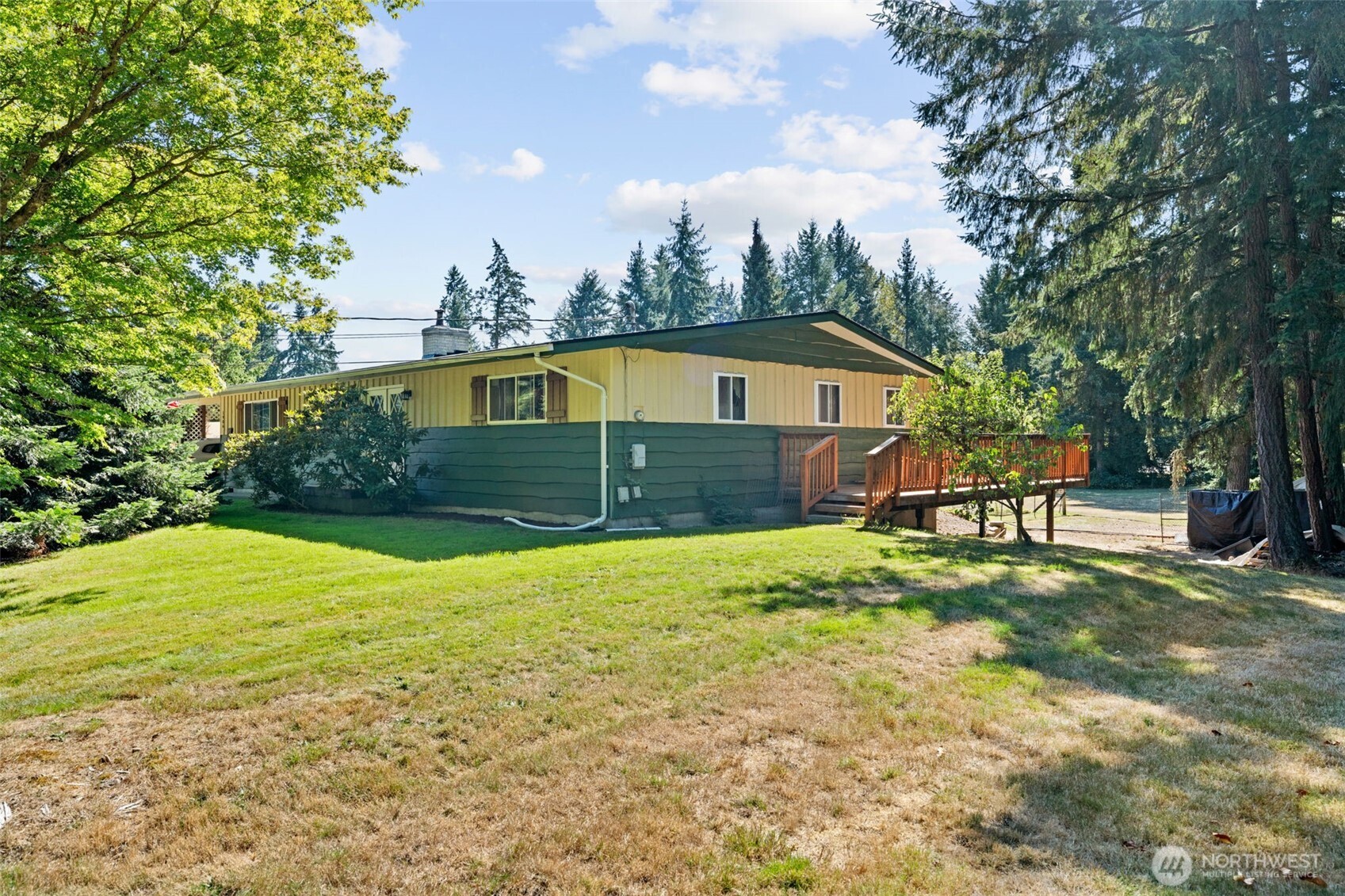 1906 164th Street South Spanaway, WA 98387 - Photo 30 of 35 a house view with a garden space