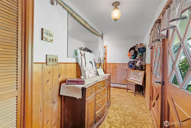 a living room with furniture a fireplace and a large window