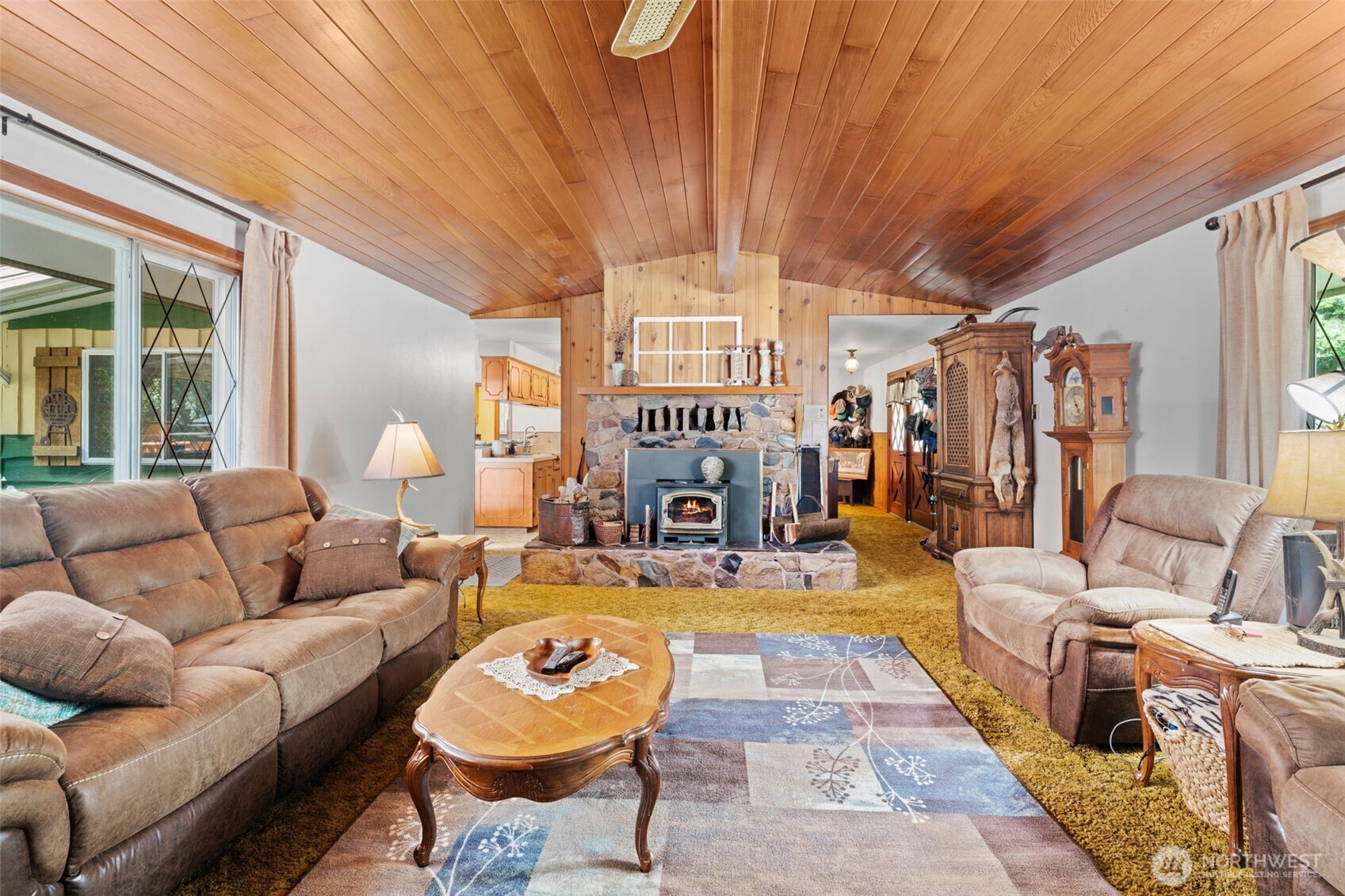 1906 164th Street South Spanaway, WA 98387 - Photo 9 of 35 a living room with furniture a fireplace and a table