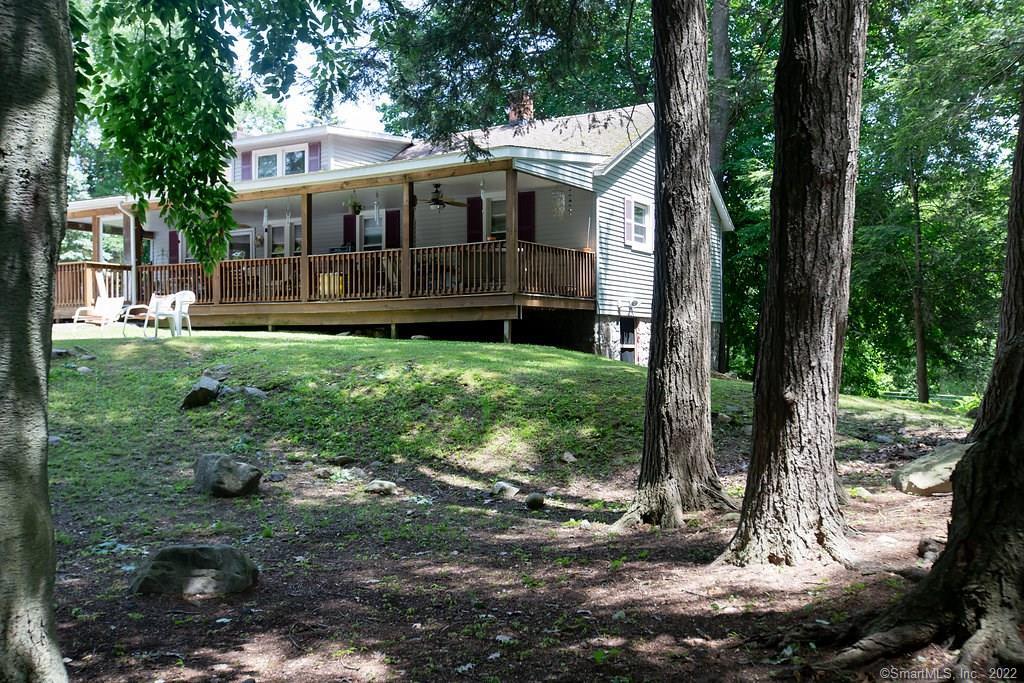 1427 Winsted Road Torrington, CT 06790 - Photo 1 of 1 a view of a house with backyard and sitting area