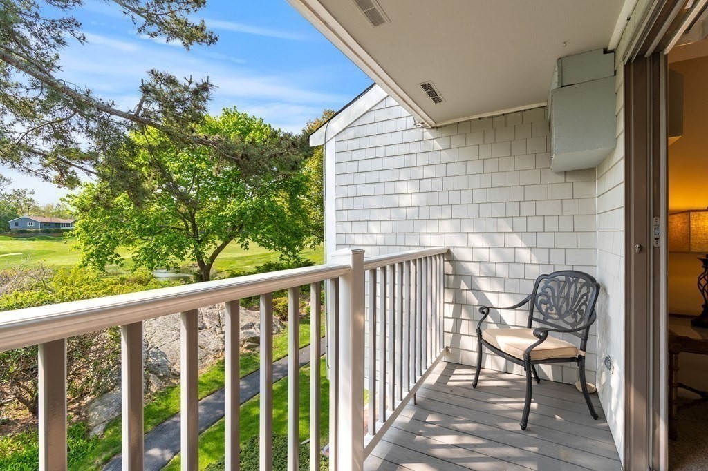 19 Atlantic Road, Unit 12 Gloucester, MA 01930 - Photo 16 of 35 a view of a balcony with chair and a potted plant