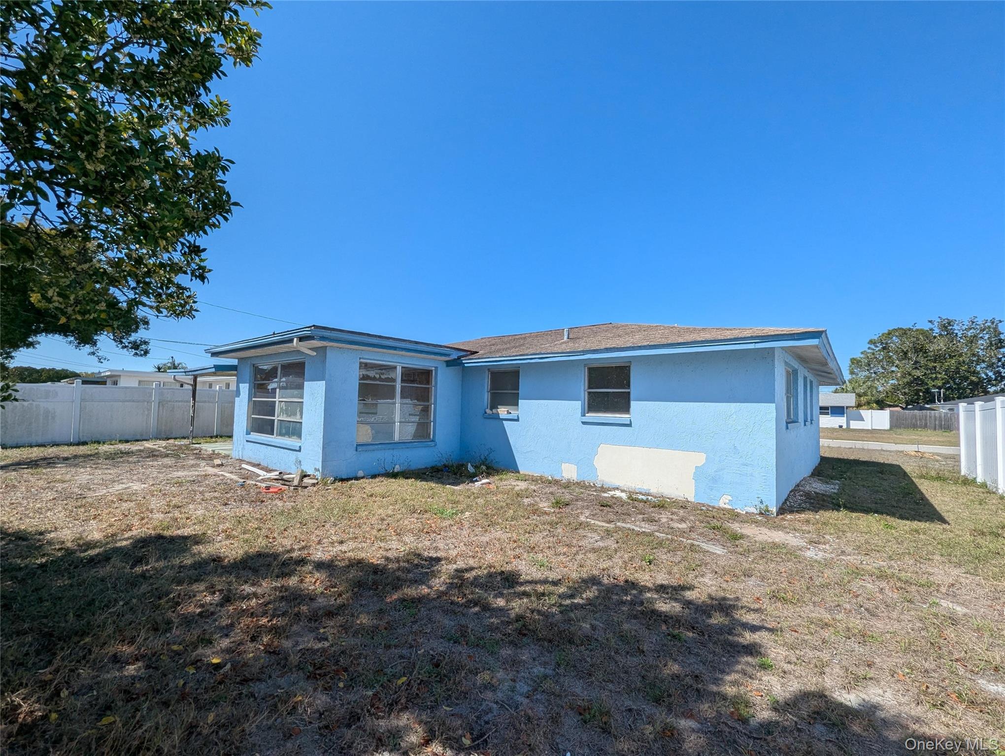 7416 Star Dust Drive Port Richey, FL 34668 - Photo 13 of 44 a view of a house with a yard