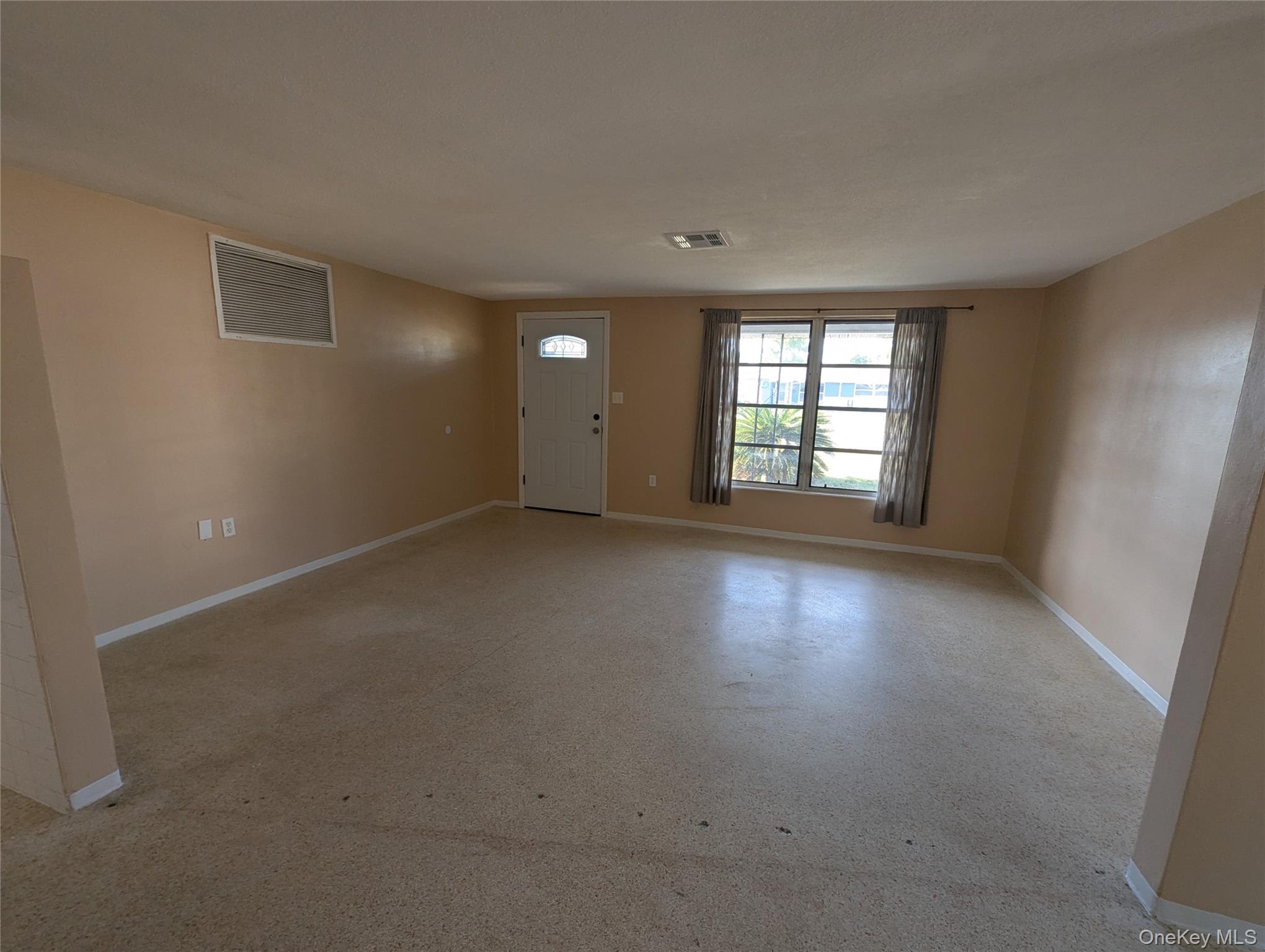 7416 Star Dust Drive Port Richey, FL 34668 - Photo 16 of 44 an empty room with a window