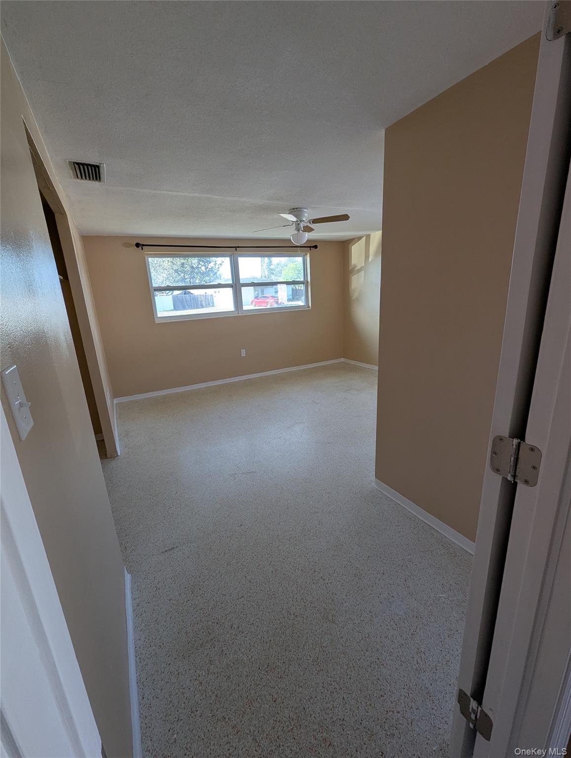 7416 Star Dust Drive Port Richey, FL 34668 - Photo 17 of 44 a view of an empty room with a window