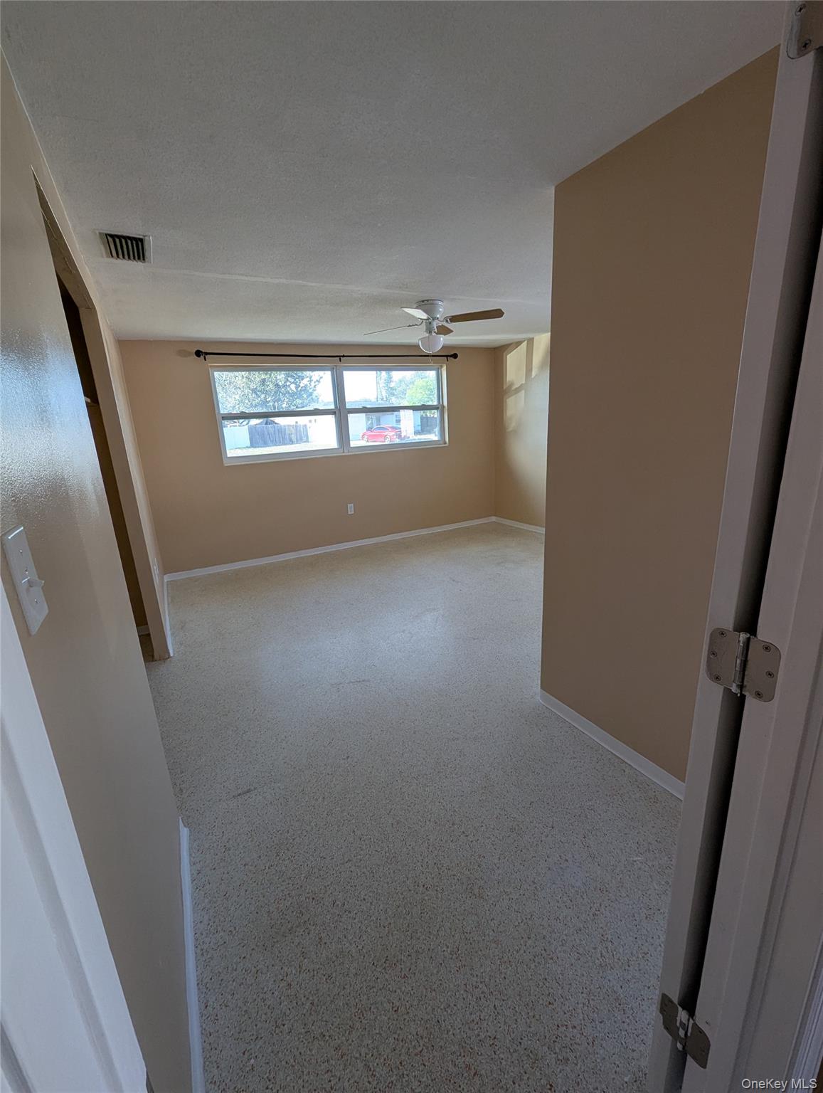 7416 Star Dust Drive Port Richey, FL 34668 - Photo 18 of 44 a view of an empty room with a window