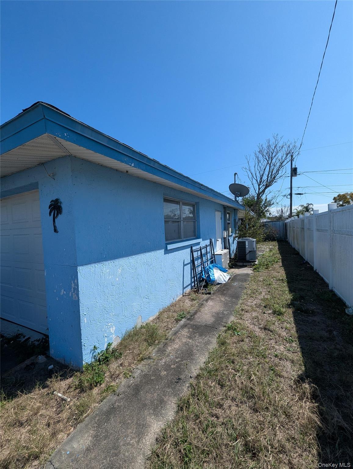 7416 Star Dust Drive Port Richey, FL 34668 - Photo 22 of 44 a backyard of a house with table and chairs
