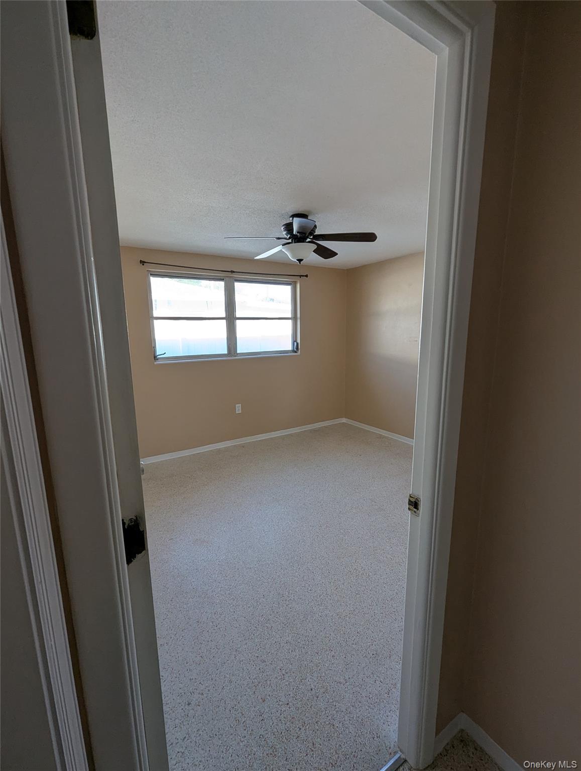 7416 Star Dust Drive Port Richey, FL 34668 - Photo 23 of 44 an empty room with windows