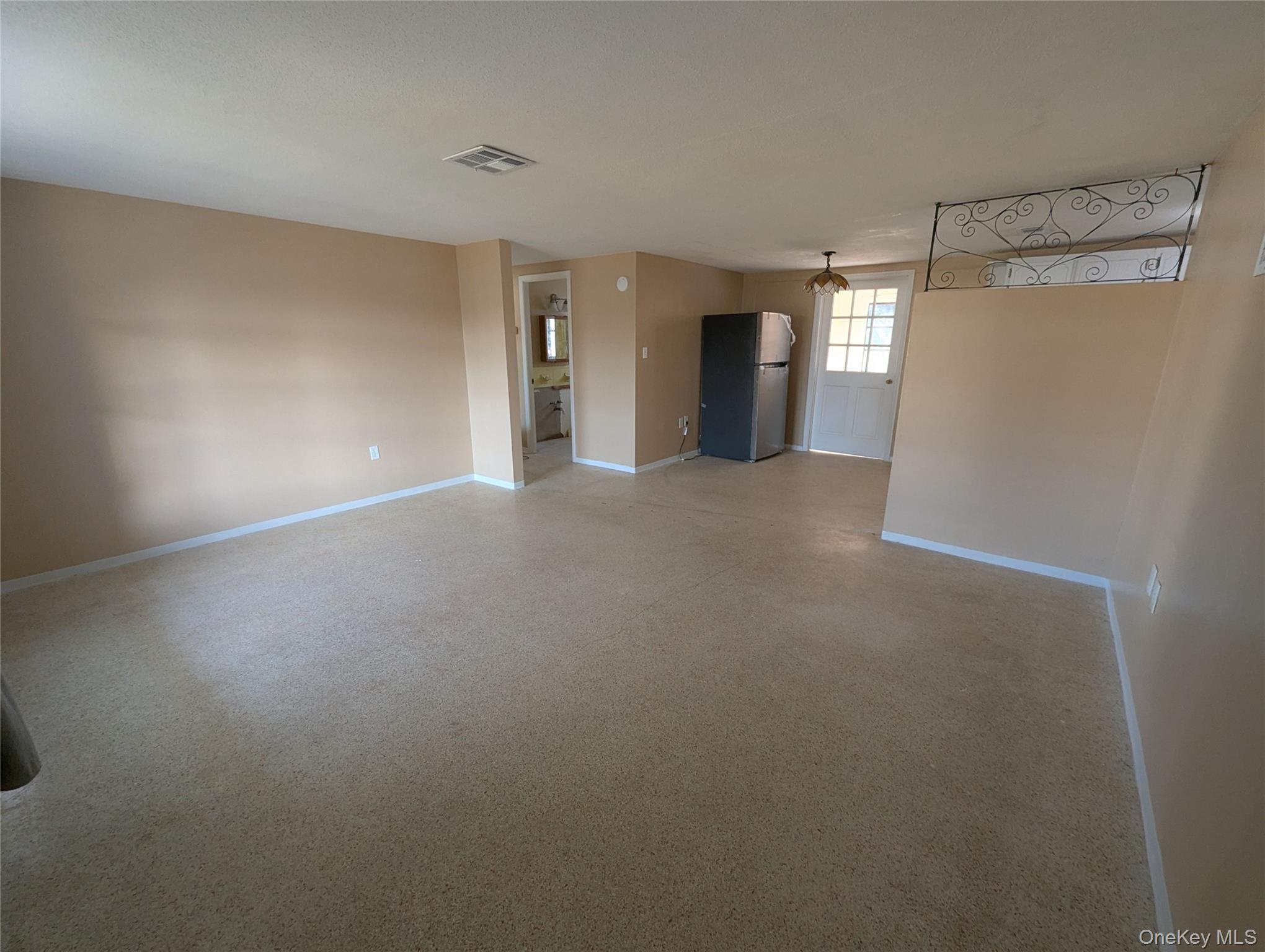 7416 Star Dust Drive Port Richey, FL 34668 - Photo 3 of 44 a view of empty room with window and fireplace