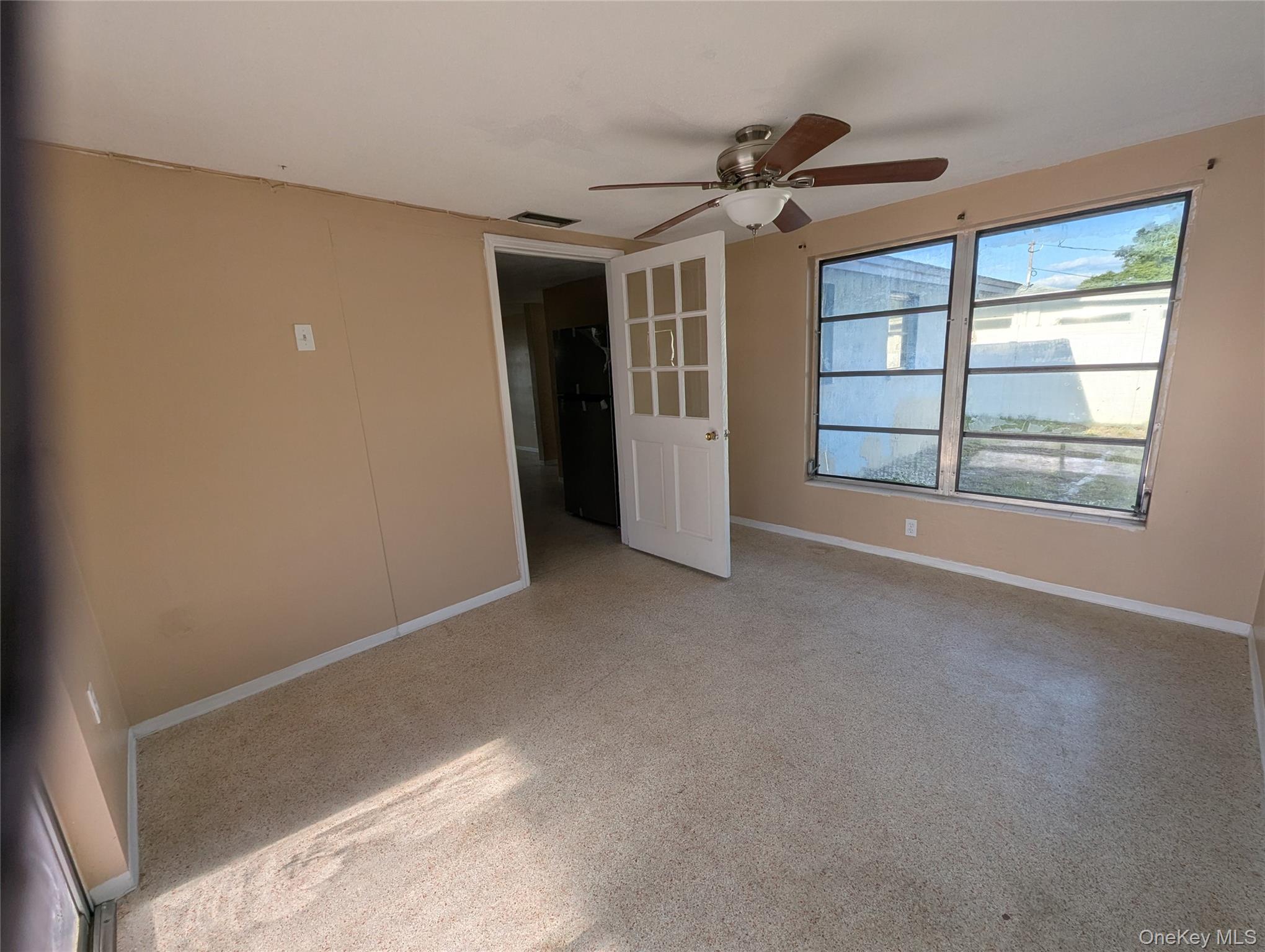 7416 Star Dust Drive Port Richey, FL 34668 - Photo 35 of 44 a view of a big room with closet and windows