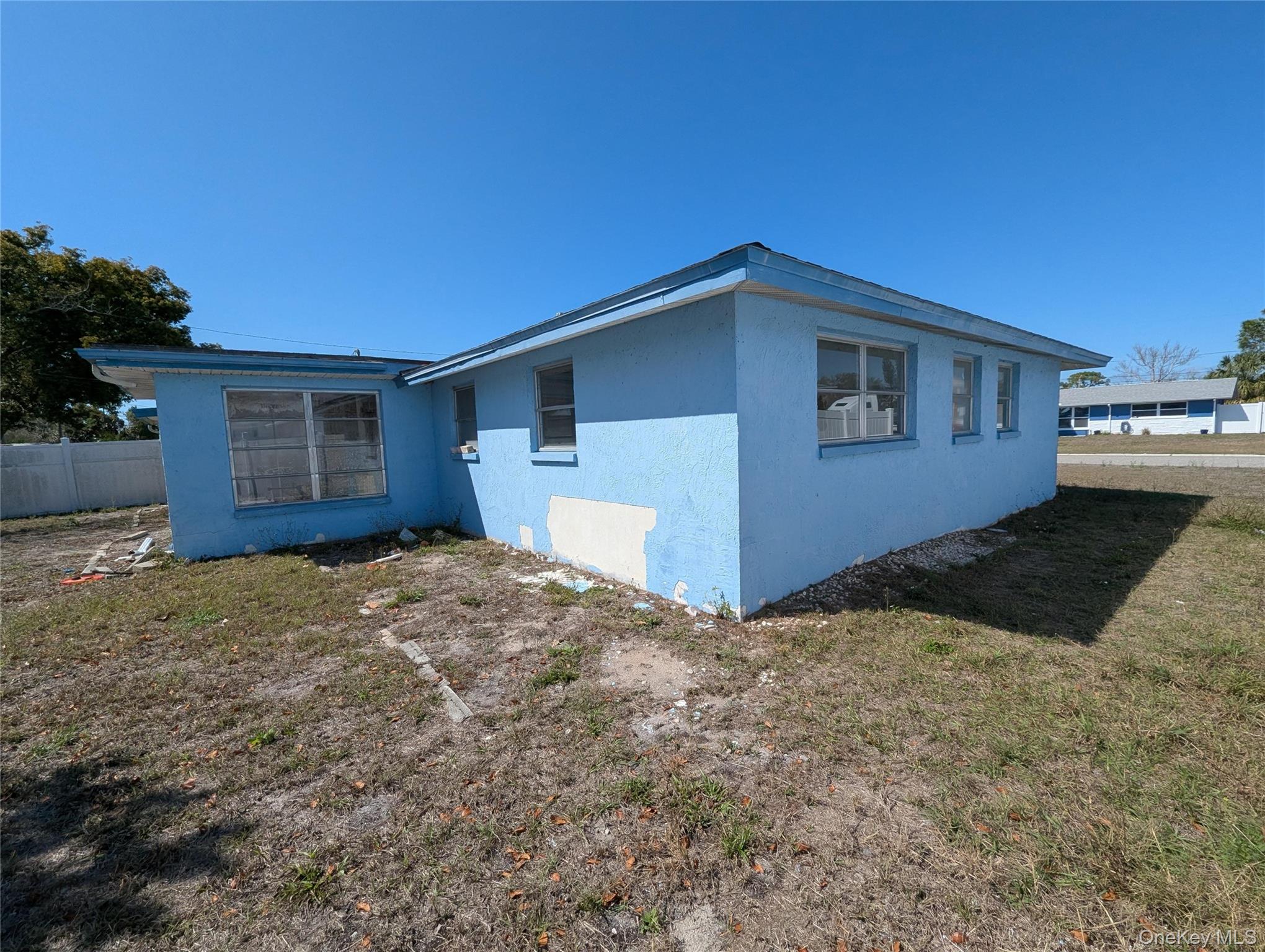 7416 Star Dust Drive Port Richey, FL 34668 - Photo 4 of 44 a house view with a backyard space