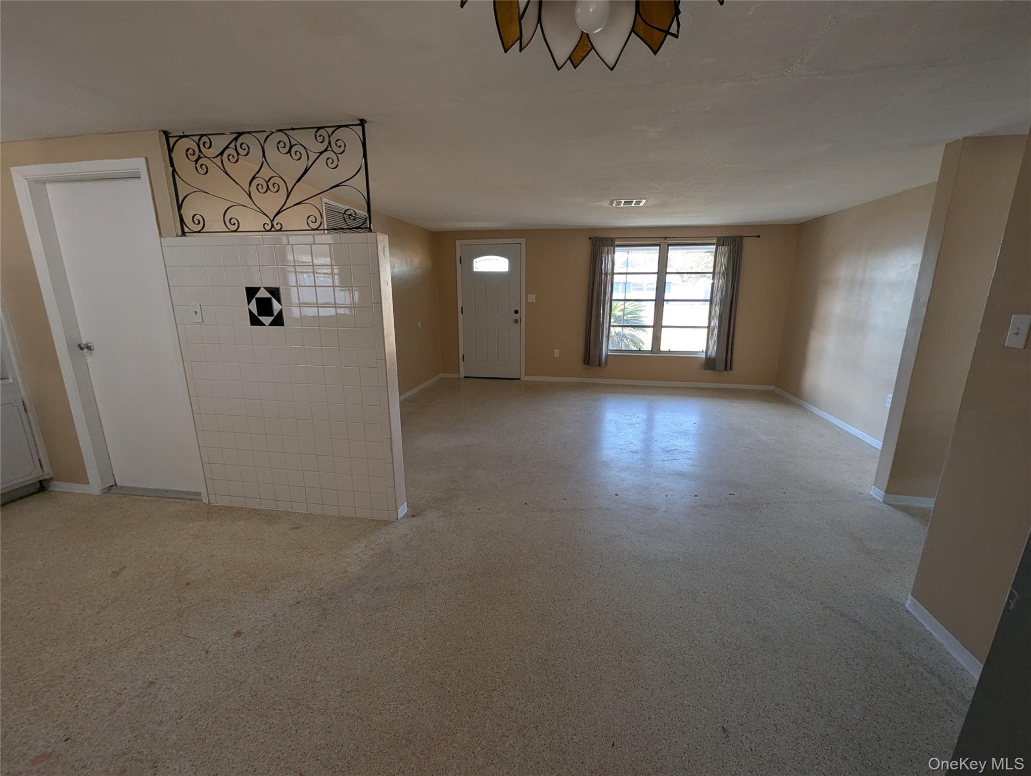 7416 Star Dust Drive Port Richey, FL 34668 - Photo 41 of 44 an empty room with windows and closet