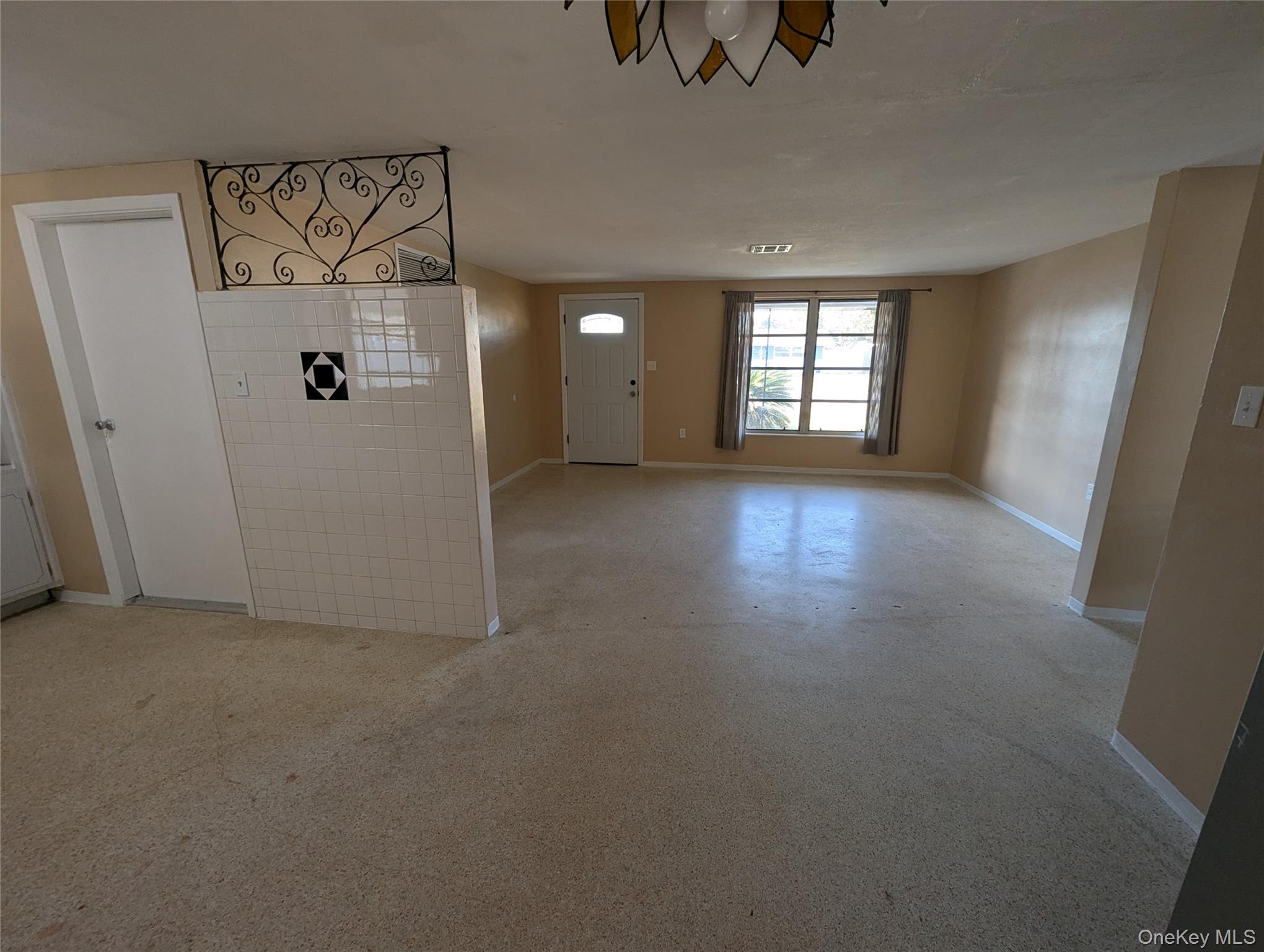 7416 Star Dust Drive Port Richey, FL 34668 - Photo 42 of 44 an empty room with windows and closet
