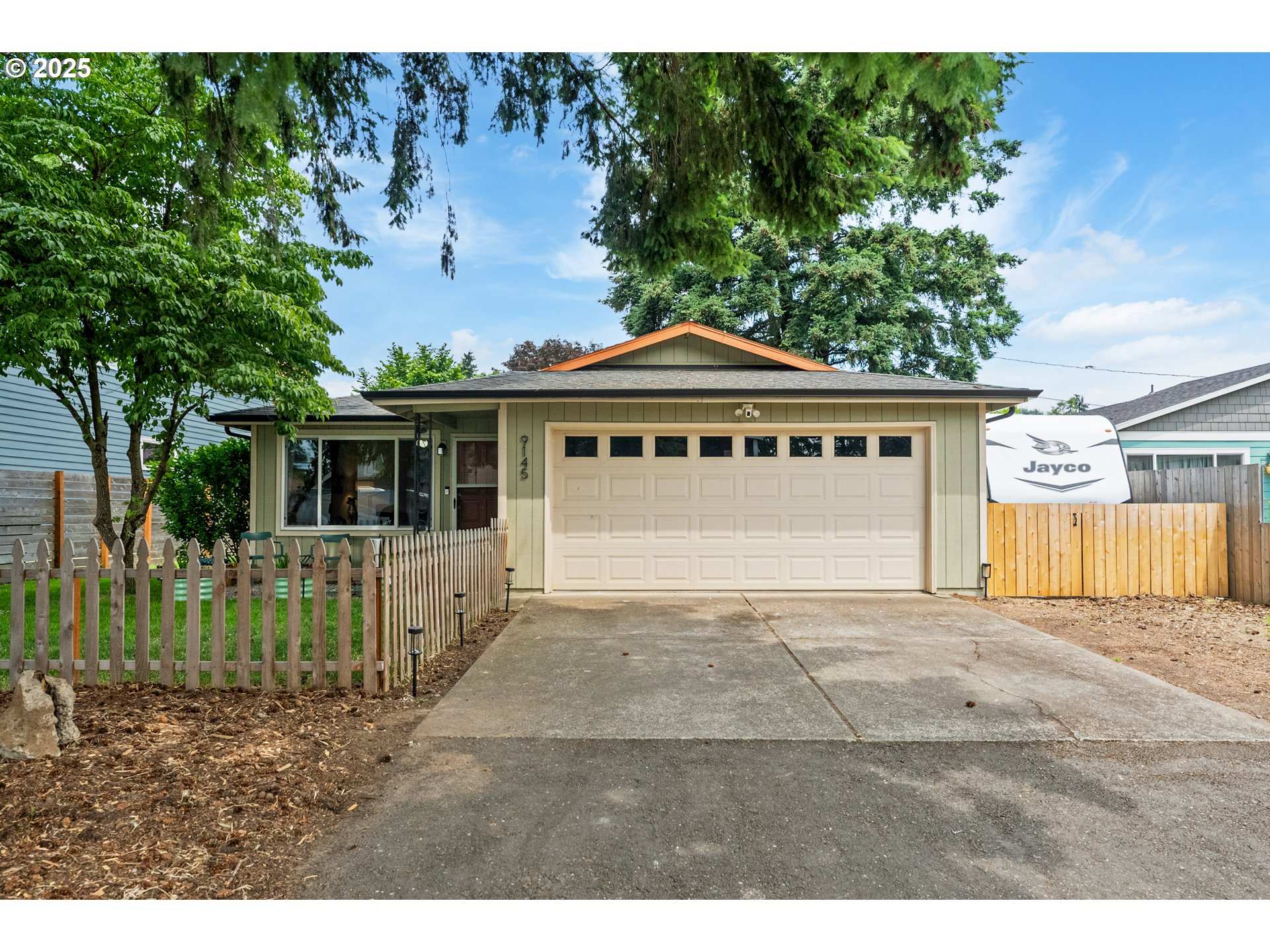 9145 Southeast Oak Street Portland, OR 97216 - Photo 1 of 27 a view of a house with a yard