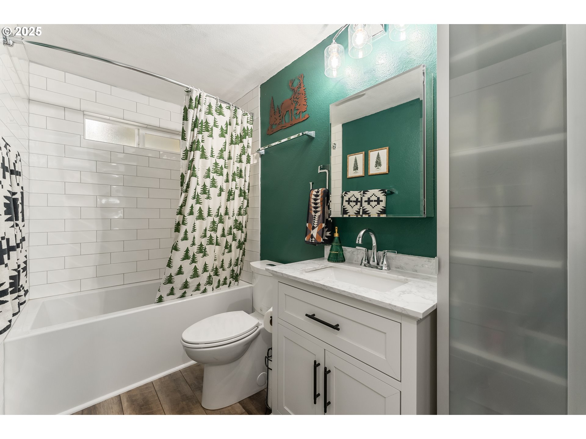 9145 Southeast Oak Street Portland, OR 97216 - Photo 13 of 27 a bathroom with a sink a toilet and shower