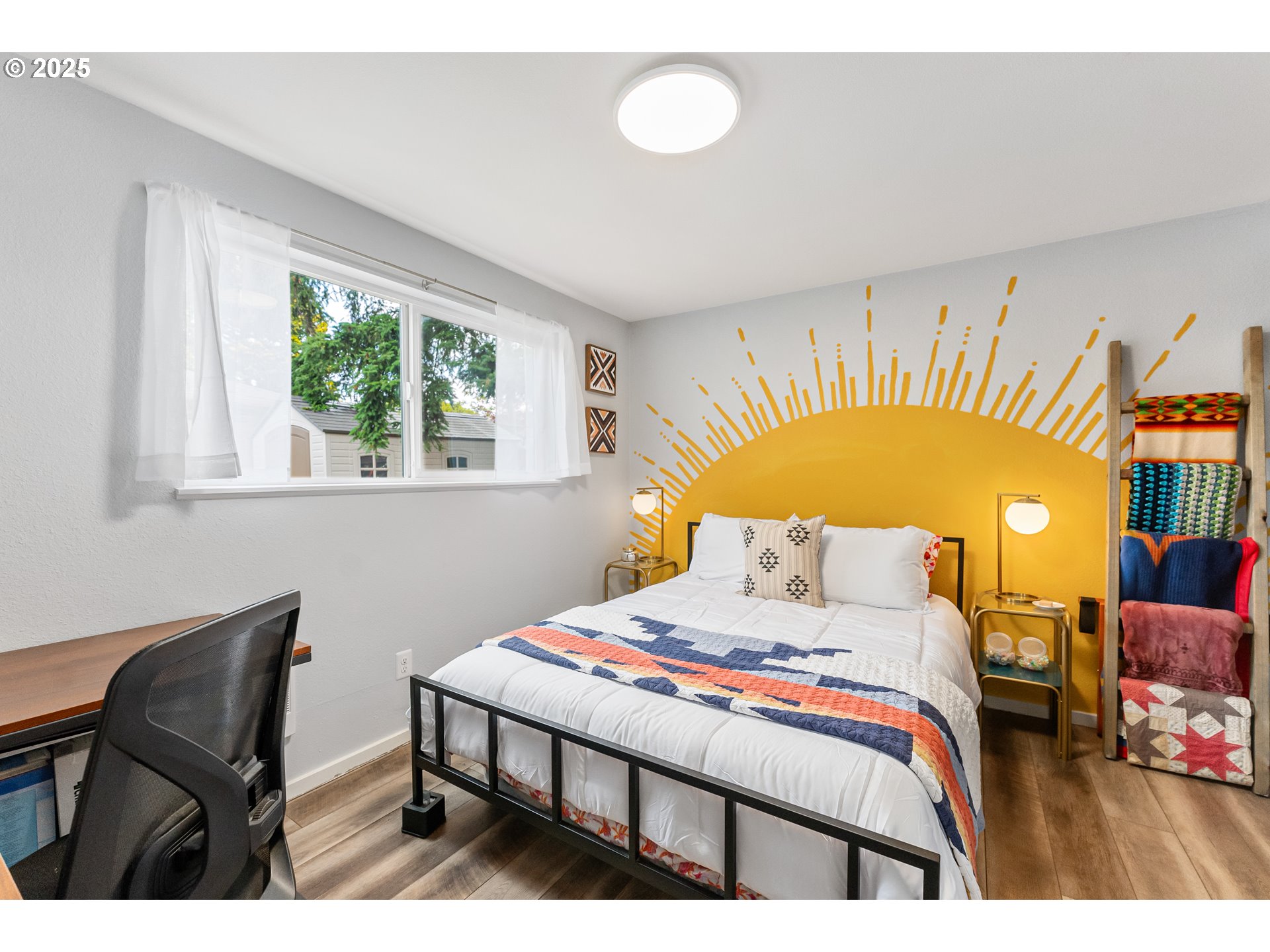 9145 Southeast Oak Street Portland, OR 97216 - Photo 14 of 27 a bedroom with a bed and a chair