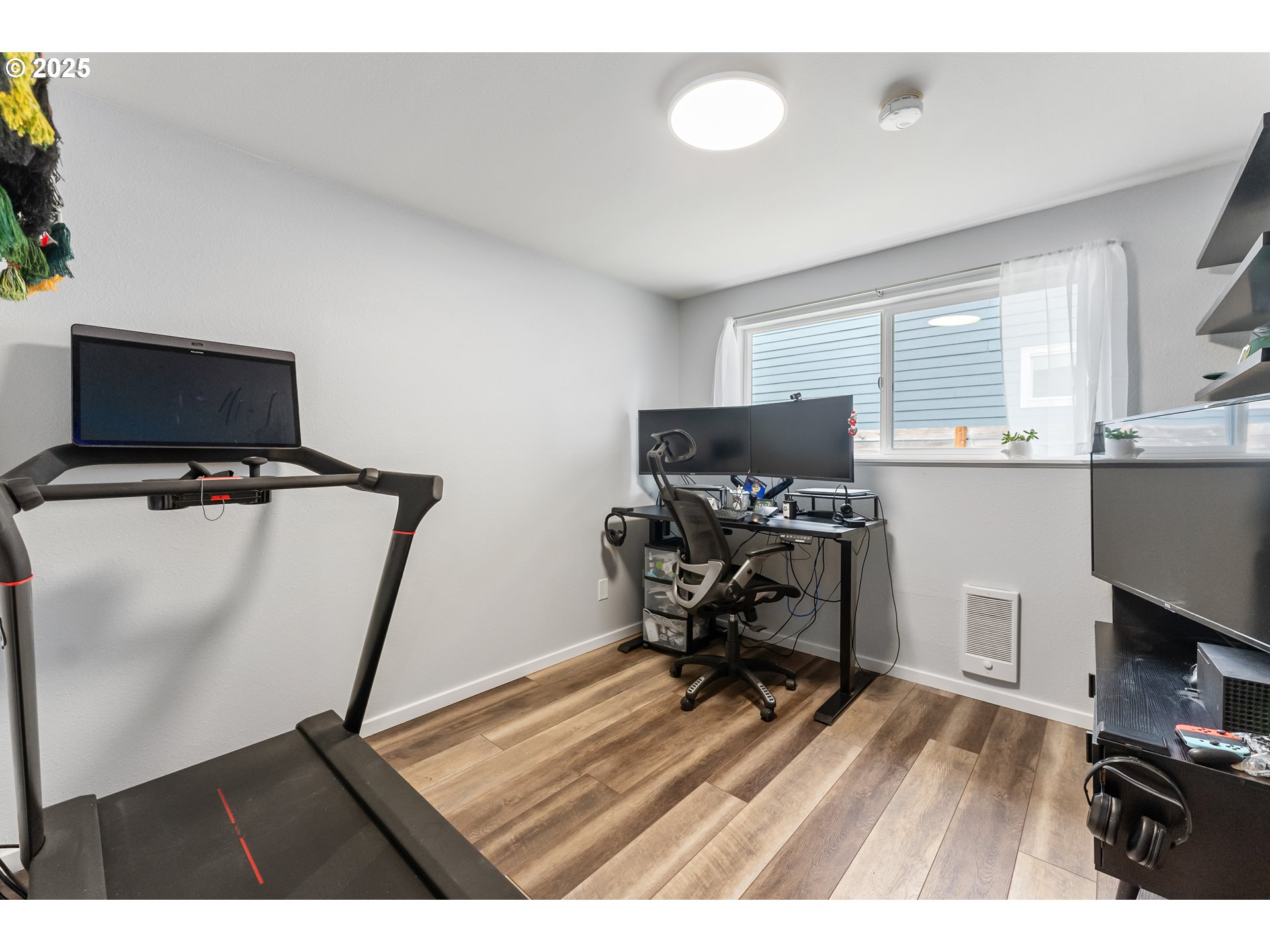 9145 Southeast Oak Street Portland, OR 97216 - Photo 16 of 27 a view of a workspace with furniture and a window
