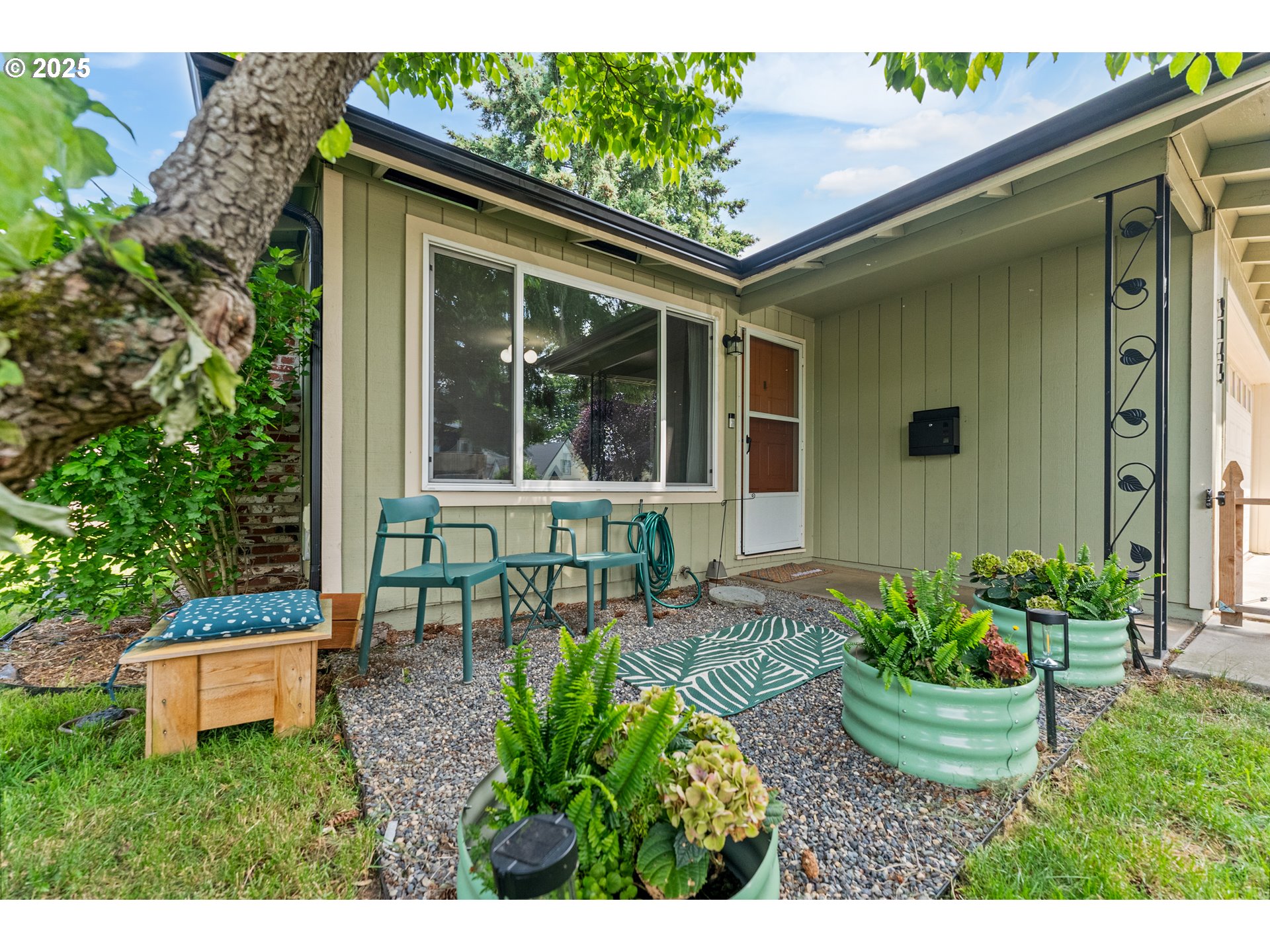 9145 Southeast Oak Street Portland, OR 97216 - Photo 2 of 27 a view of a chair and table in back yard of the house