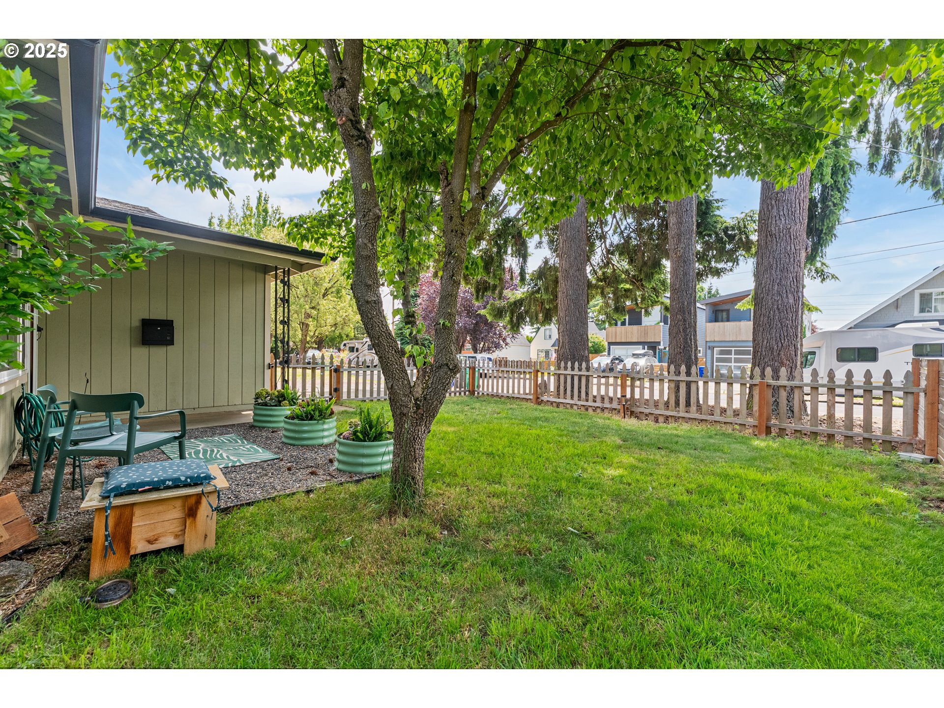 9145 Southeast Oak Street Portland, OR 97216 - Photo 26 of 27 a backyard of a house with seating space and trees