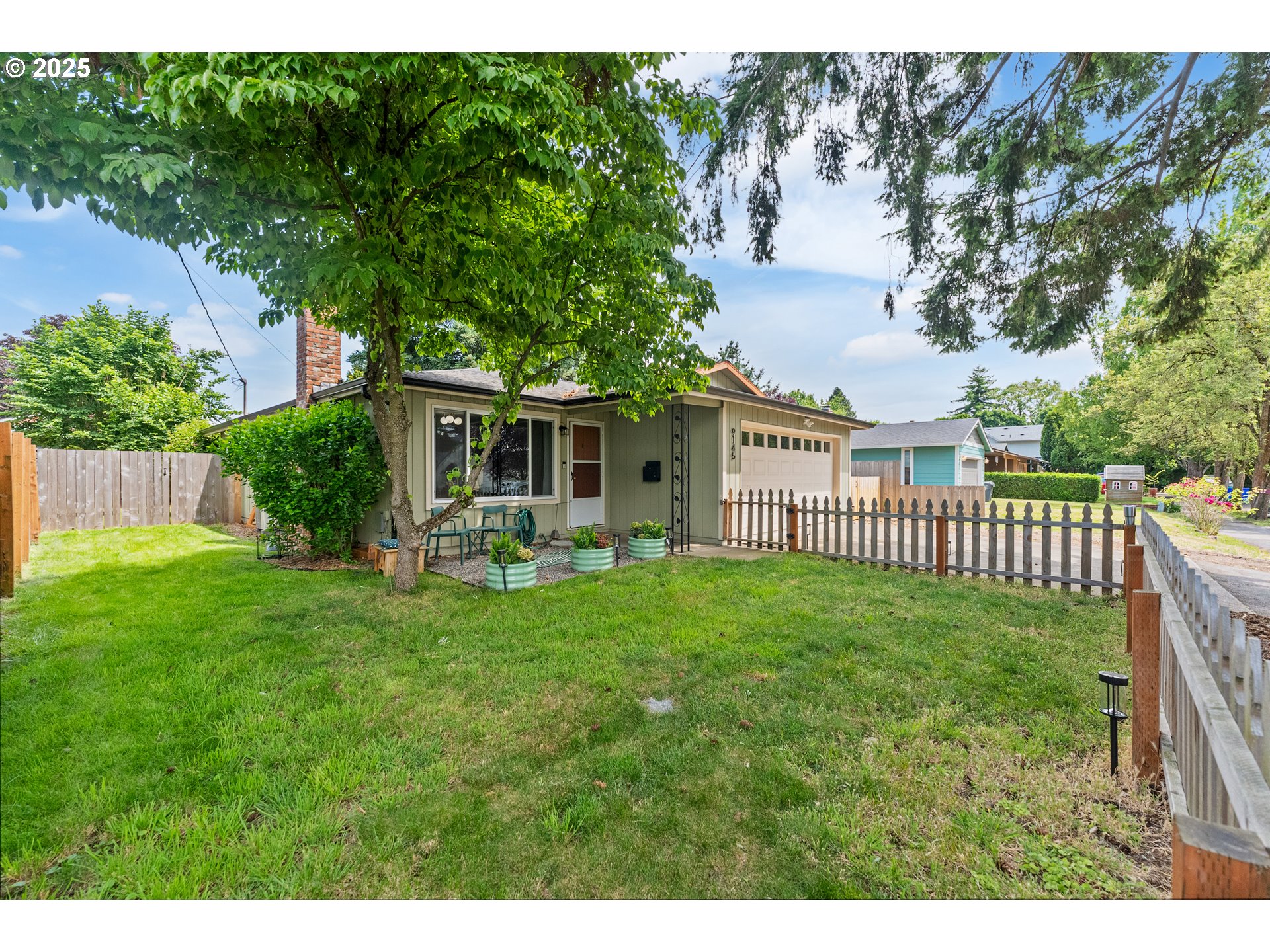 9145 Southeast Oak Street Portland, OR 97216 - Photo 27 of 27 a view of a house with a backyard and porch