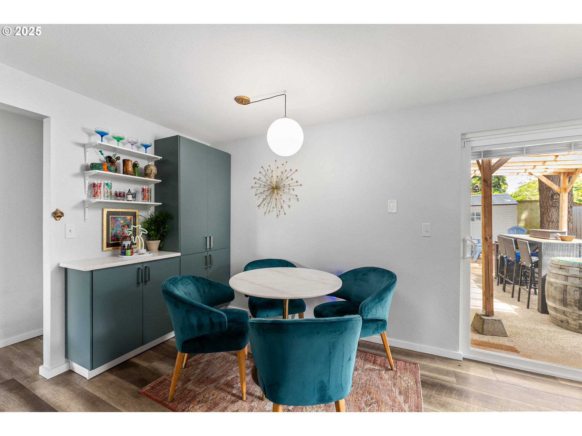 9145 Southeast Oak Street Portland, OR 97216 - Photo 8 of 27 a view of a dining room with furniture and a potted plant