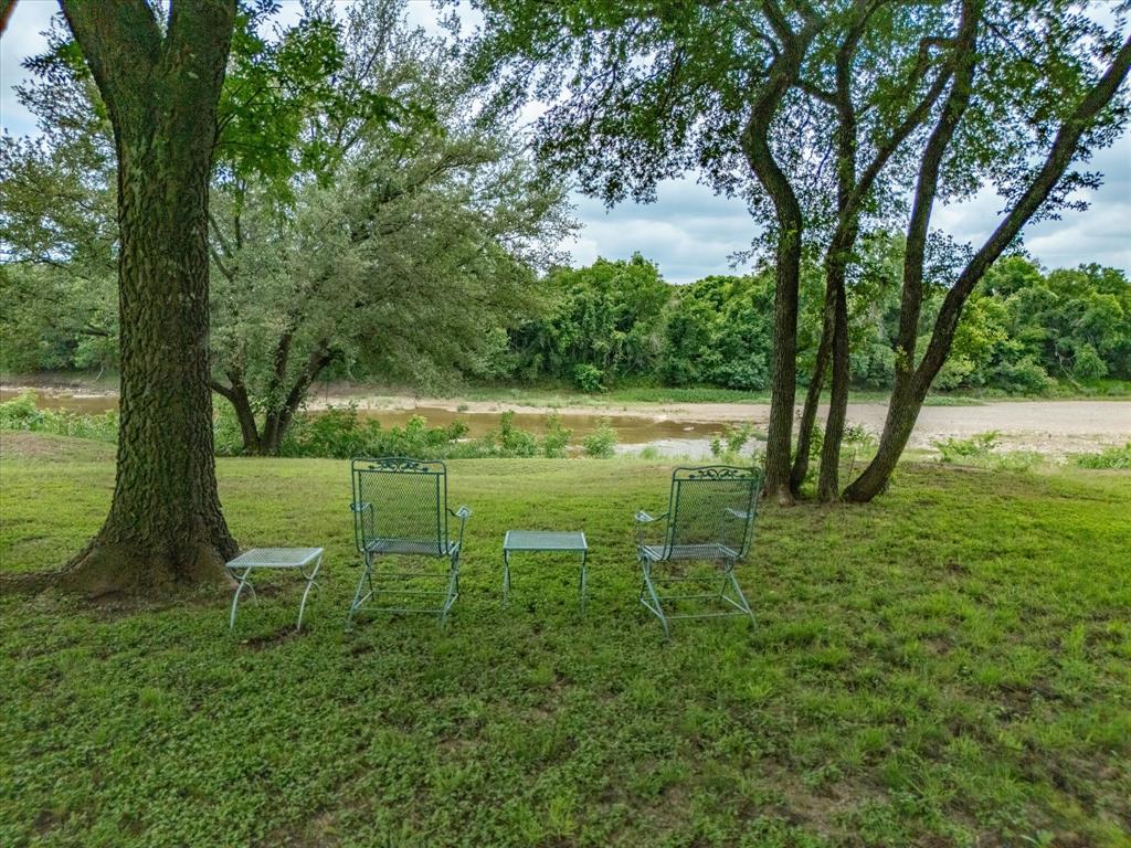 10106 Ravenswood Road Granbury, TX 76049 - Photo 30 of 39 a view of a golf course with a lake
