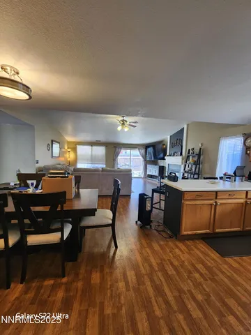 a living room with furniture kitchen view and a table