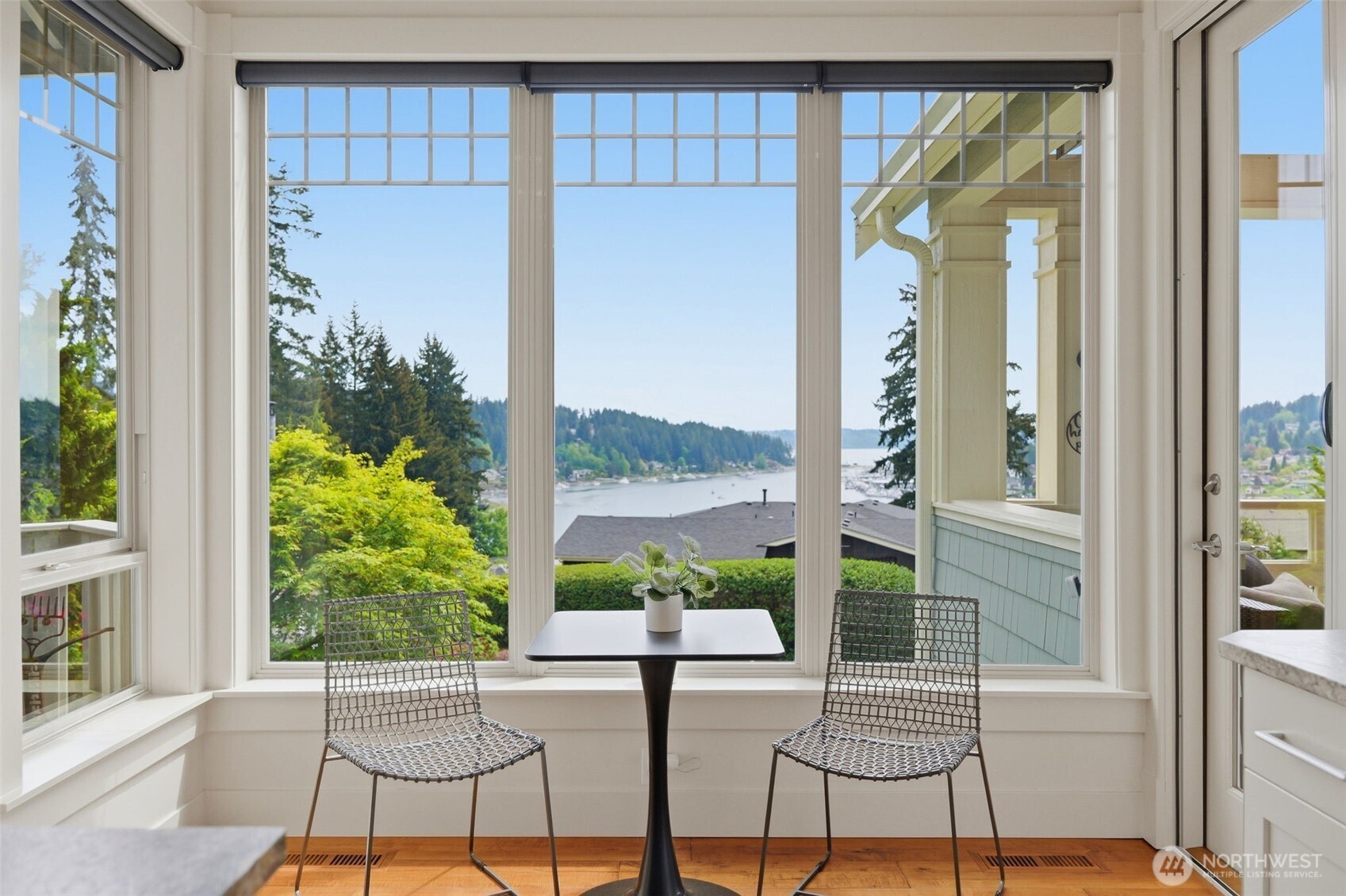 3915 Bay View Lane Gig Harbor, WA 98332 - Photo 14 of 40 a view of a porch with a table and chairs