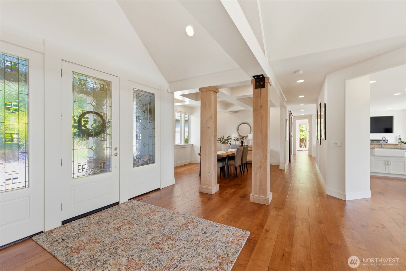 3915 Bay View Lane Gig Harbor, WA 98332 - Photo 18 of 40 wooden floor in an empty room with a fireplace