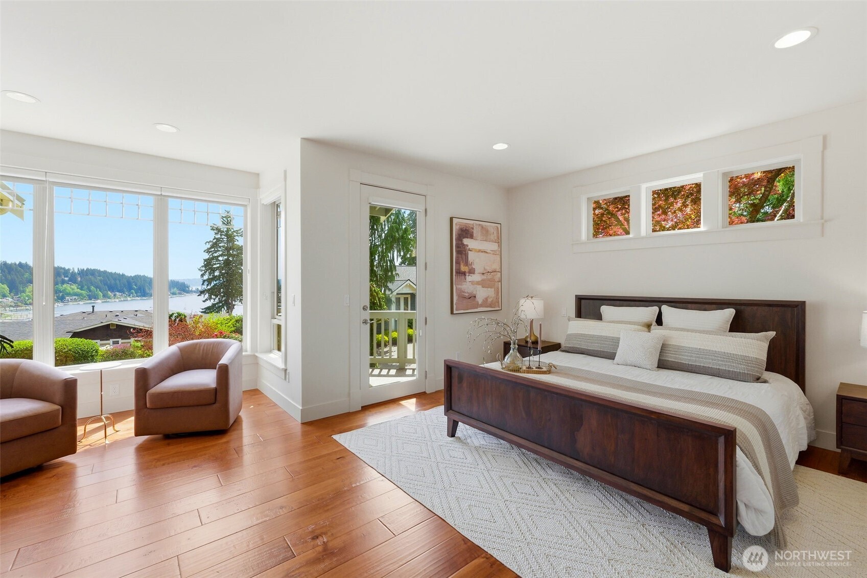 3915 Bay View Lane Gig Harbor, WA 98332 - Photo 21 of 40 a bedroom with a bed and glass window