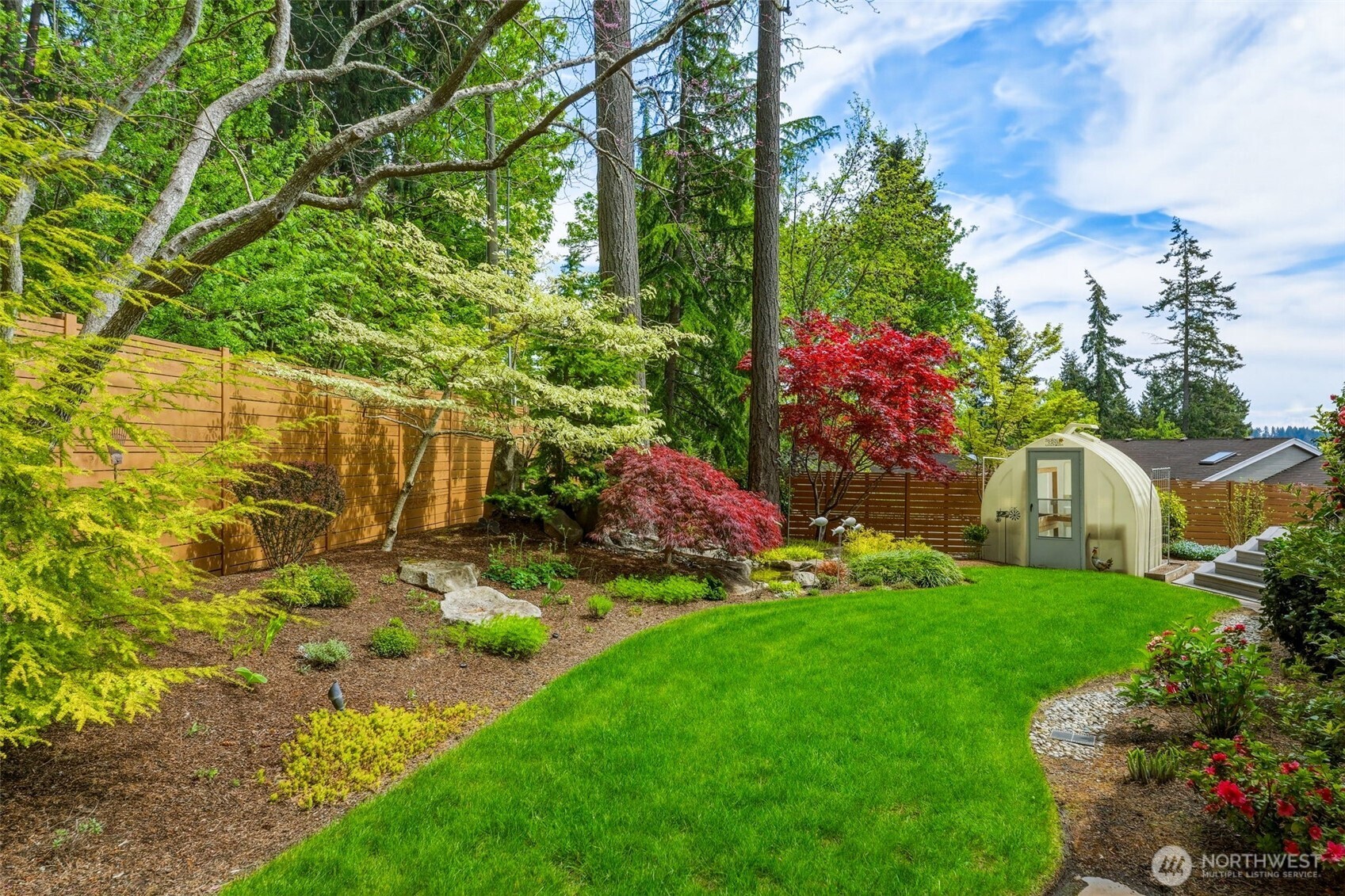 3915 Bay View Lane Gig Harbor, WA 98332 - Photo 29 of 40 a view of a house with a yard and garden