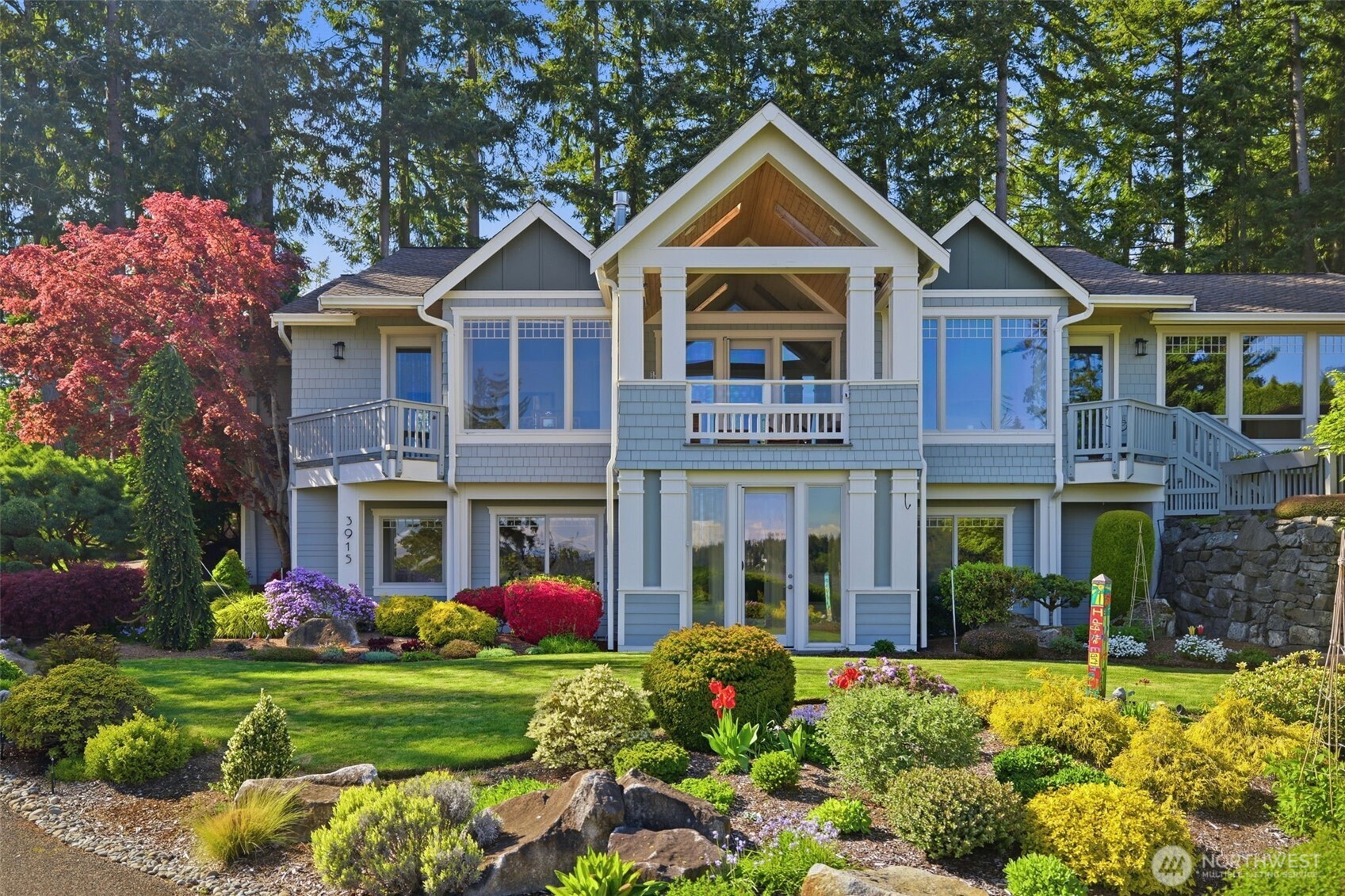 3915 Bay View Lane Gig Harbor, WA 98332 - Photo 30 of 40 a front view of a house with garden