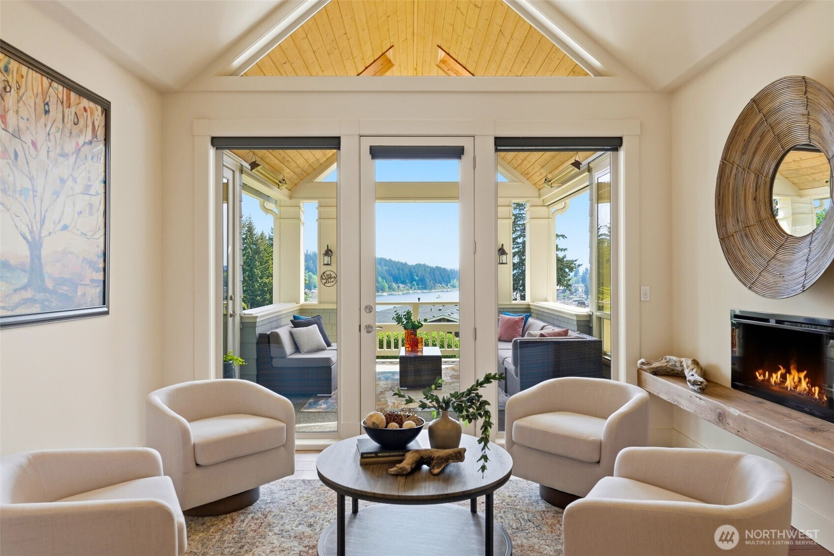 3915 Bay View Lane Gig Harbor, WA 98332 - Photo 5 of 40 a living room with furniture a window and a fireplace