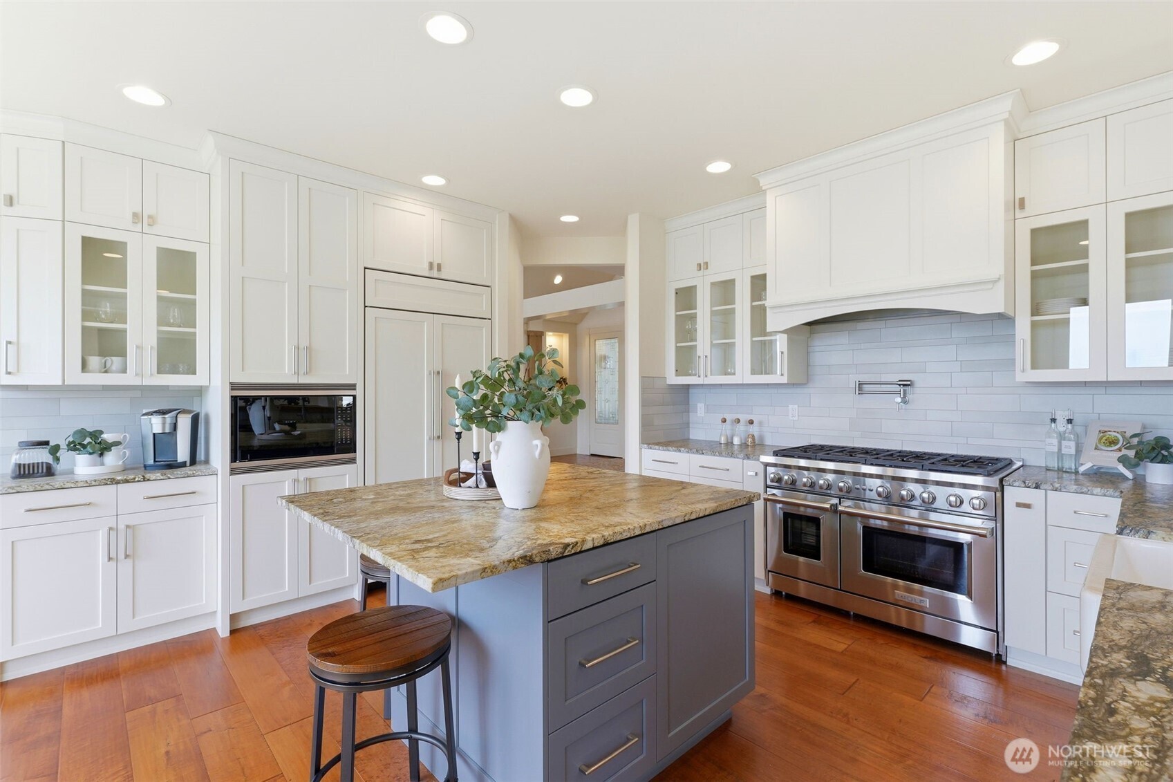 3915 Bay View Lane Gig Harbor, WA 98332 - Photo 6 of 40 a kitchen with a stove and a white cabinets