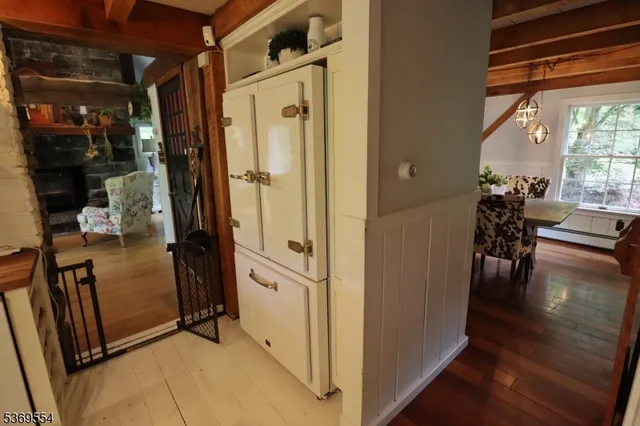a view of a porch with furniture and wooden floors