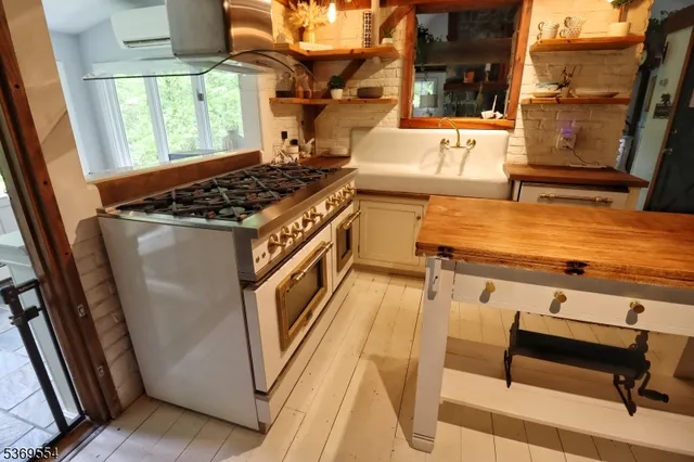 a kitchen with a stove and a refrigerator