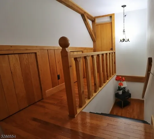 a bedroom with a bed and a potted plant