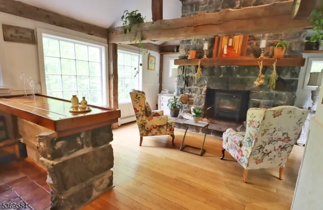a view of dining room with wooden floor and furniture