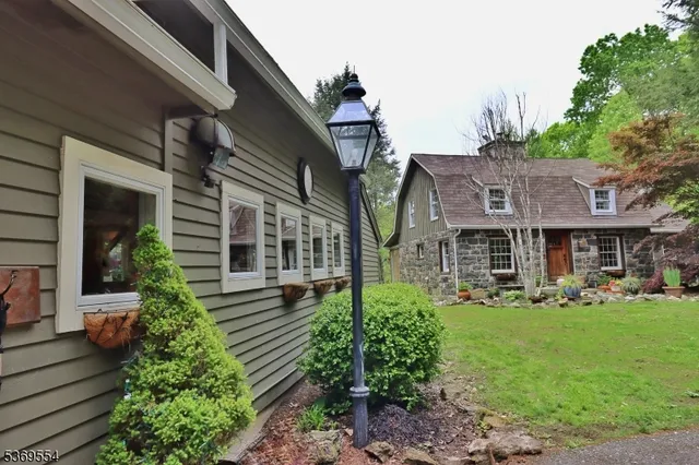 a view of a porch with wooden floor and furniture